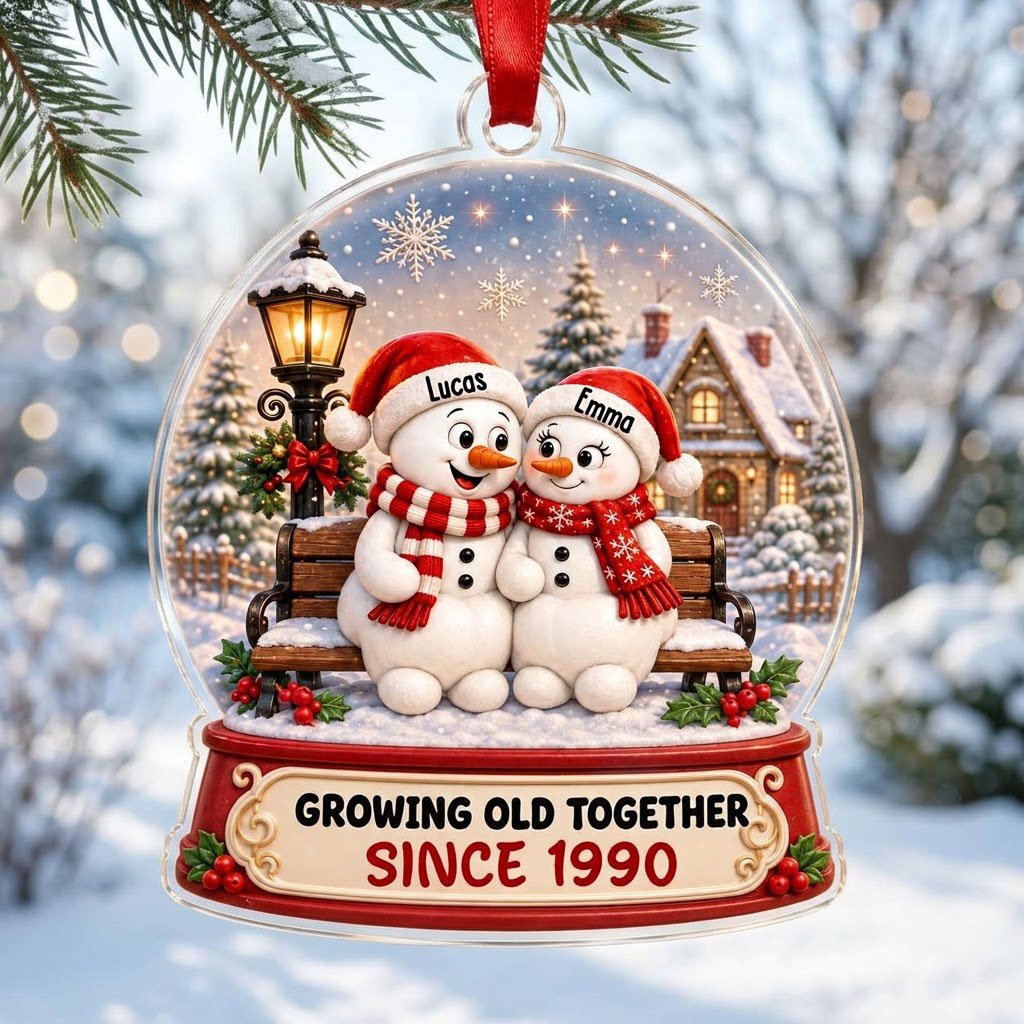 Acrylic snowglobe ornament with two snowmen on a bench, Santa hats, and Growing Old Together text.