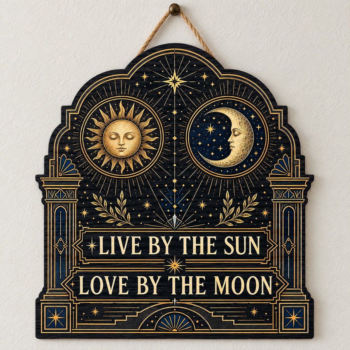 Arched wooden sign with sun and moon faces, constellations, and 'Live By The Sun, Love By The Moon'.