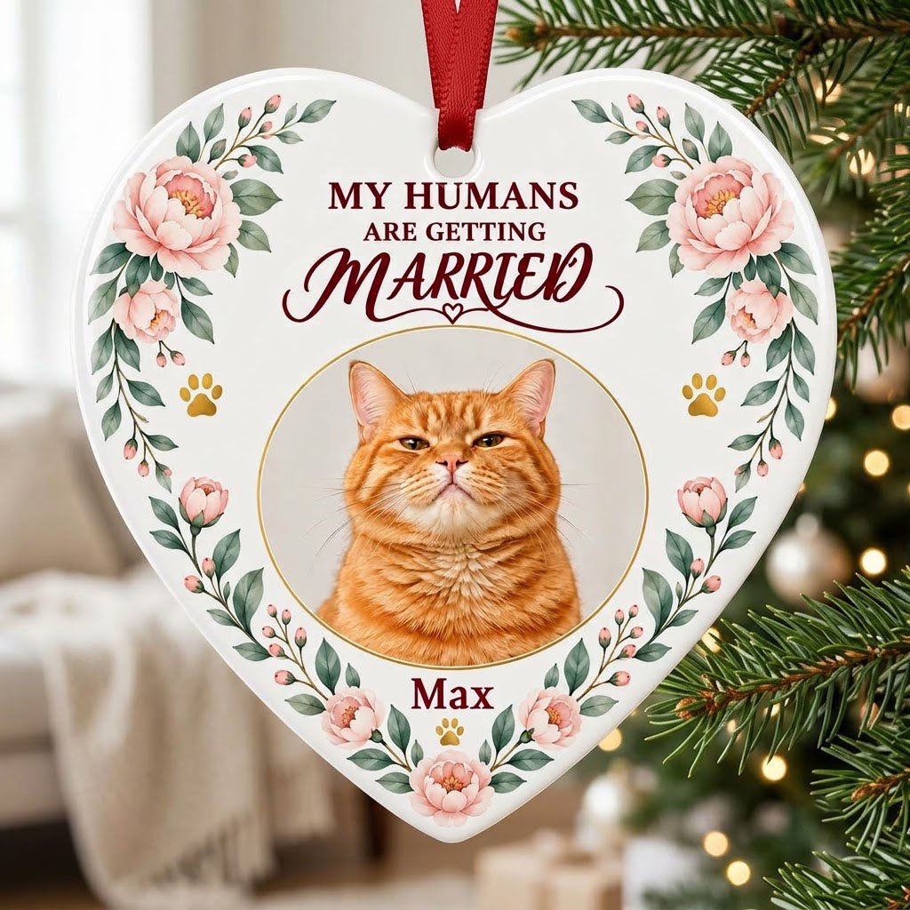 Heart ceramic ornament with 'My Humans Are Getting Married,' a cat photo, pink florals, gold paw prints, and a heart ico