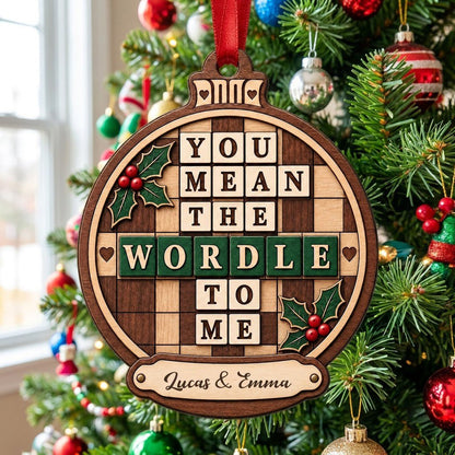 Bauble wood ornament with 'You Mean The Wordle To Me', green WORDLE tiles, holly and personalized names