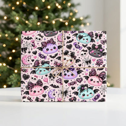 Pastel goth Halloween wrapping paper with cute bat-winged characters, skulls, moons, bows and candies.