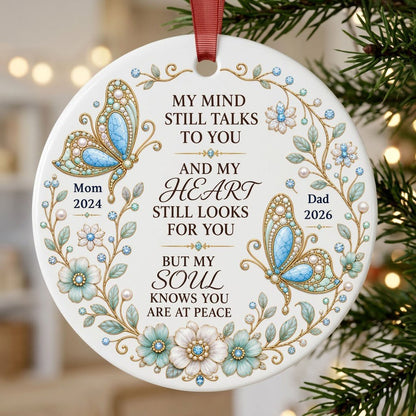 White round ornament with jeweled butterflies, floral wreath, and memorial quote with personalized name and year.