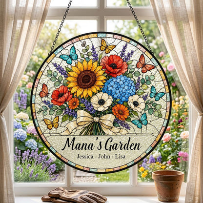 Round stained-glass style suncatcher with floral bouquet, butterflies, and 'Mana's Garden' with names.