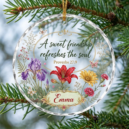 Round faceted glass ornament with florals, gold accents, butterflies, and 'A sweet friendship refreshes the soul'.