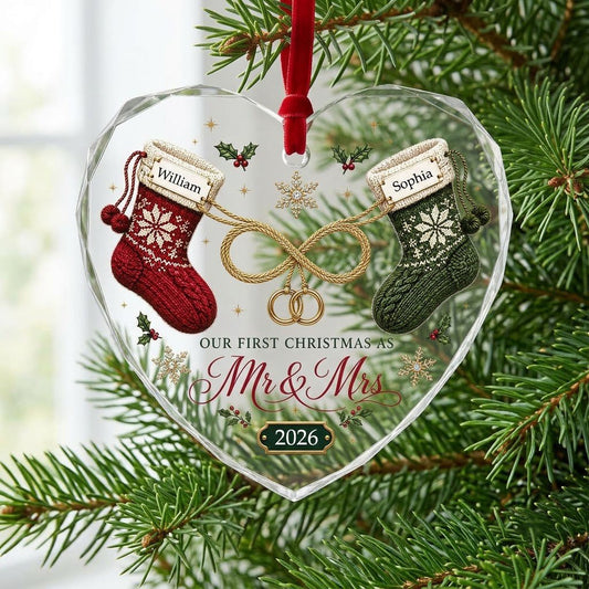 Heart glass ornament with red and green knit stockings, gold infinity loop with rings, Mr & Mrs text, names and date.