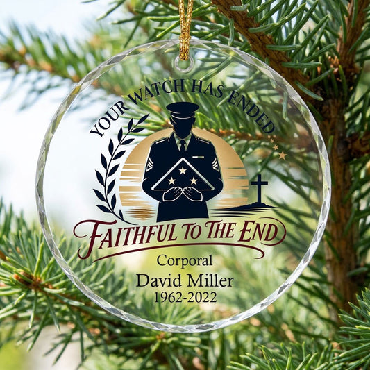 Round glass ornament with officer silhouette holding a folded flag, golden sunset, cross, and the words YOUR WATCH HAS E