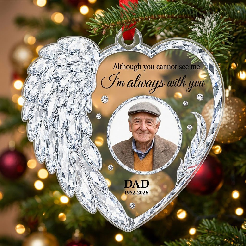 Clear acrylic heart ornament with crystal wing on the left, diamond accents, and a central circular photo frame.