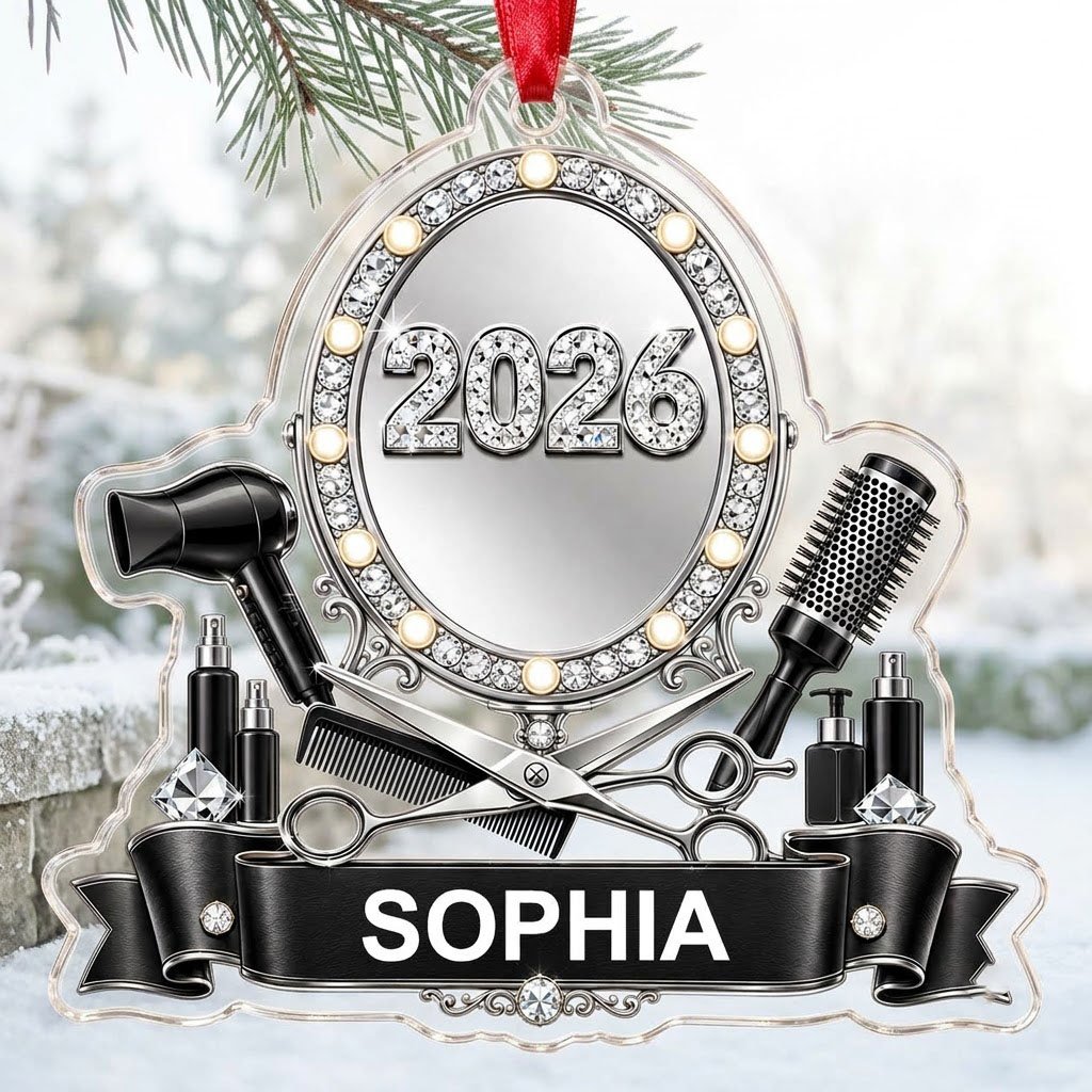 Clear acrylic ornament with a lit vanity mirror and salon tools, featuring SOPHIA and 2026 on a black banner.