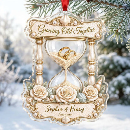 Acrylic hourglass ornament with gold rings, roses, seashells, pearls, and Growing Old Together text.