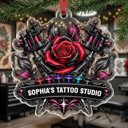 Clear acrylic ornament with red and black rose, crossed tattoo machines, caps, and SOPHIA'S TATTOO STUDIO text.