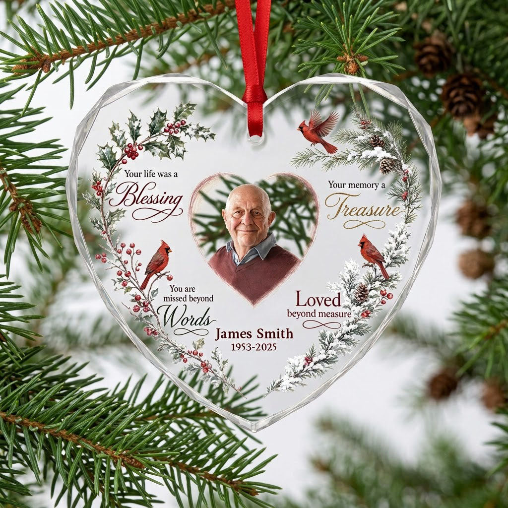 Heart glass ornament with a photo, red cardinals, and a winter wreath of pine, holly, berries, and pinecones.