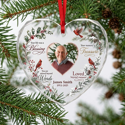 Heart glass ornament with a photo, red cardinals, and a winter wreath of pine, holly, berries, and pinecones.