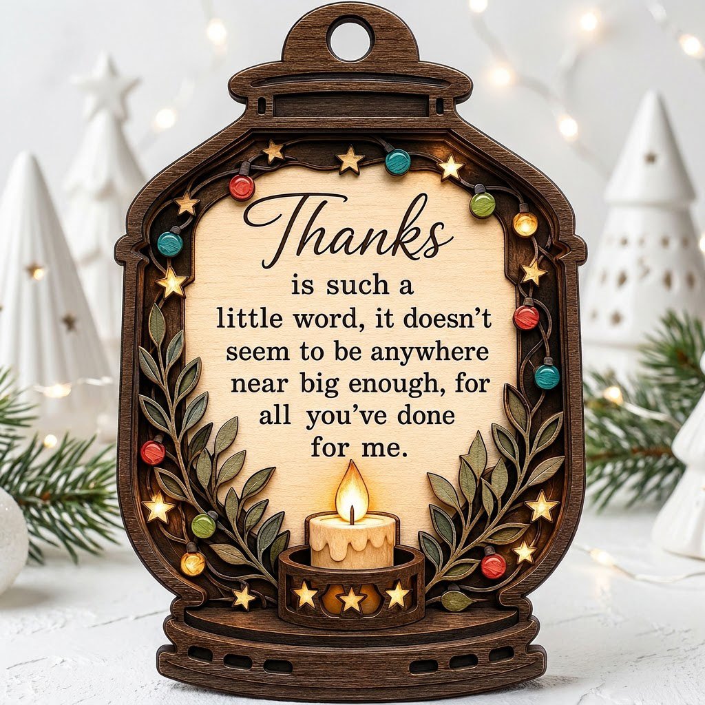 Lantern-shaped wood ornament with candle, colorful fairy lights, leafy branches, and a thank-you quote.