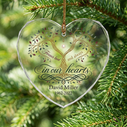 Heart glass ornament with a golden tree of life and the text 'Forever loved and always in our hearts'.