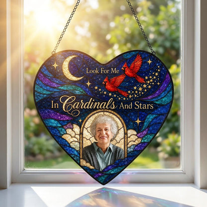 Heart-shaped stained glass suncatcher with night sky, moon, stars, two red cardinals, and a golden photo frame.