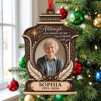 Lantern-shaped memorial wood ornament with oval photo, two feathers, starburst, fleur-de-lis and scrollwork accents.