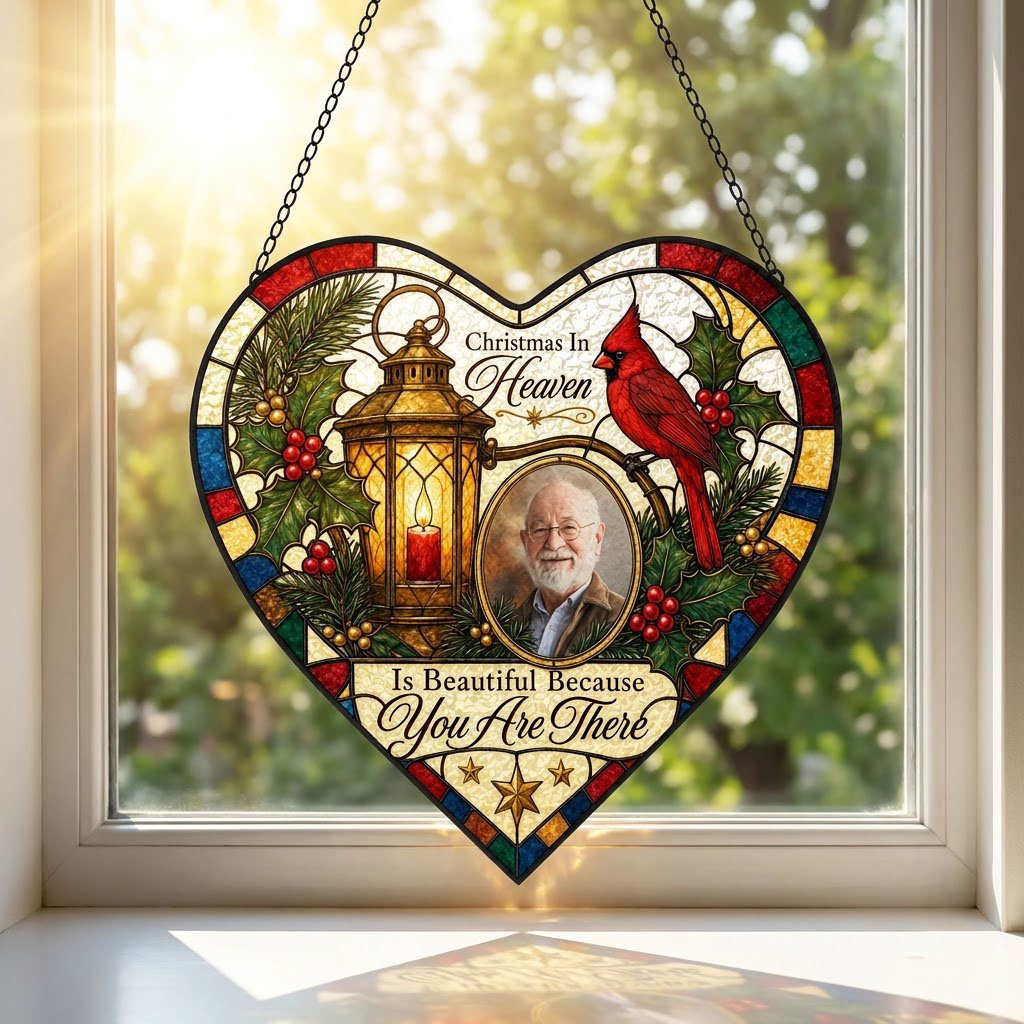 Heart stained glass suncatcher with lantern, red candle, red cardinal, holly, pine, and an oval photo frame.