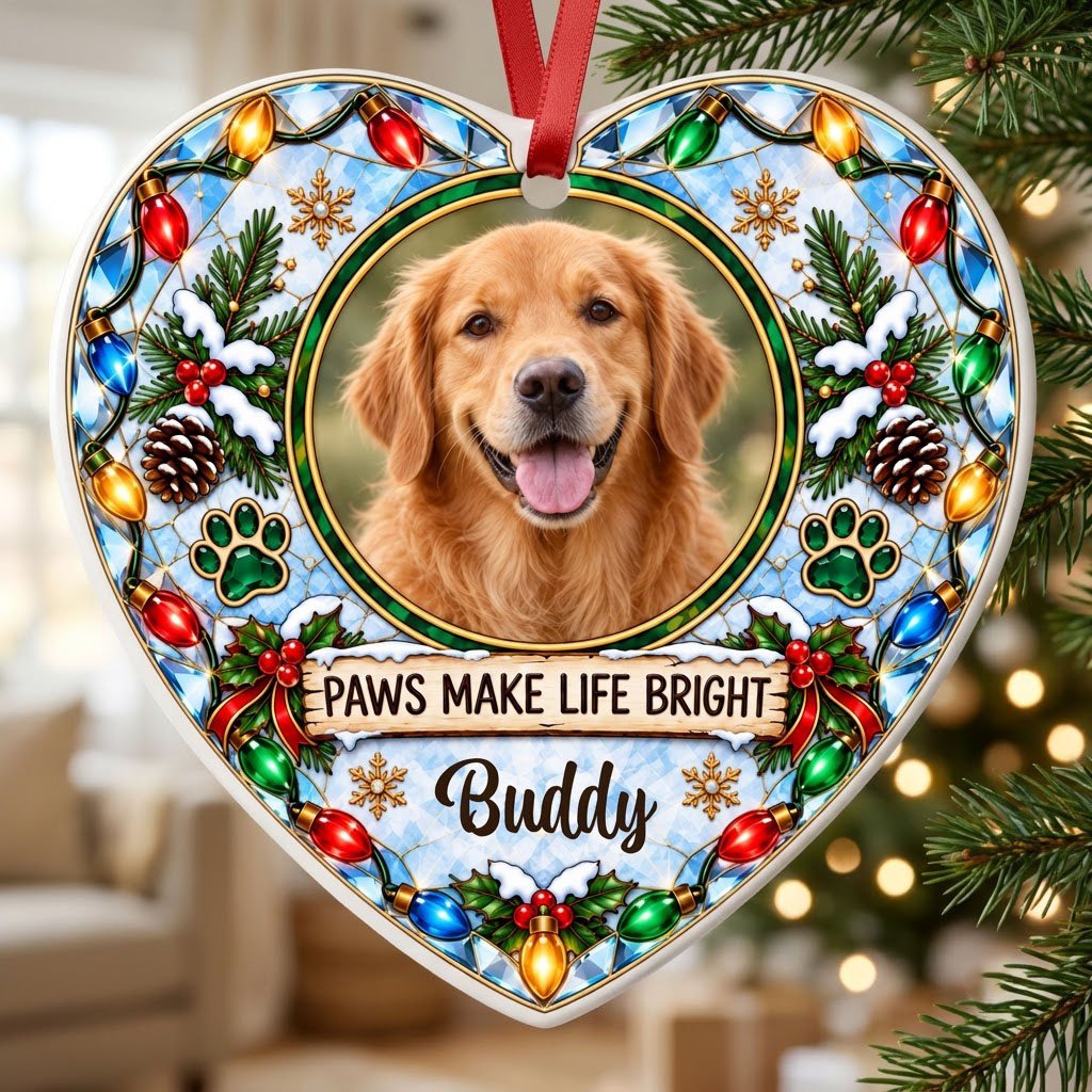 Heart ceramic ornament with dog photo frame, “PAWS MAKE LIFE BRIGHT”, lights, pine branches, paw prints, and red ribbon 