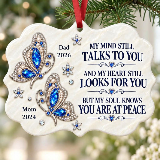 Scalloped ceramic ornament with two blue jeweled butterflies, silver starburst flowers and a memorial quote.