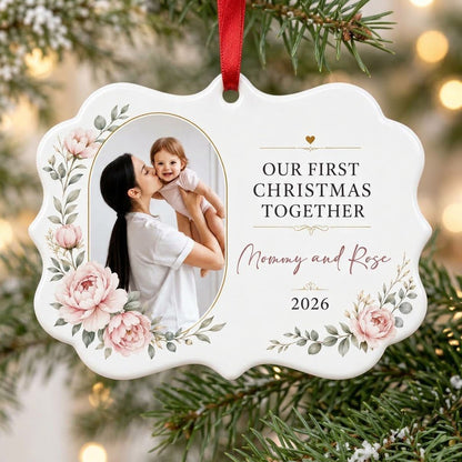 White scalloped ceramic ornament with gold oval photo frame, pink peonies, and Our First Christmas Together text.
