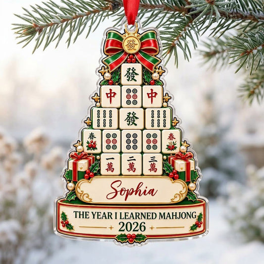 Acrylic tree ornament of mahjong tiles with bow, stars, holly, pearls, and two cream banners for name and year.