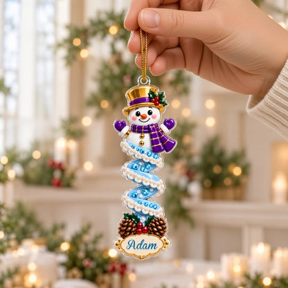Clear acrylic ornament with a cartoon elf or Mrs. Claus, spiral ribbon body, holly, and a white name scroll.