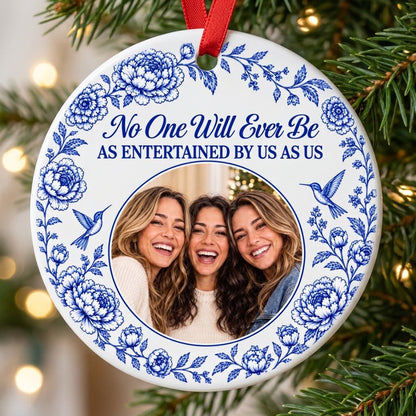 Round white ceramic ornament with blue floral border, two hummingbirds and a central circular photo frame with friends.