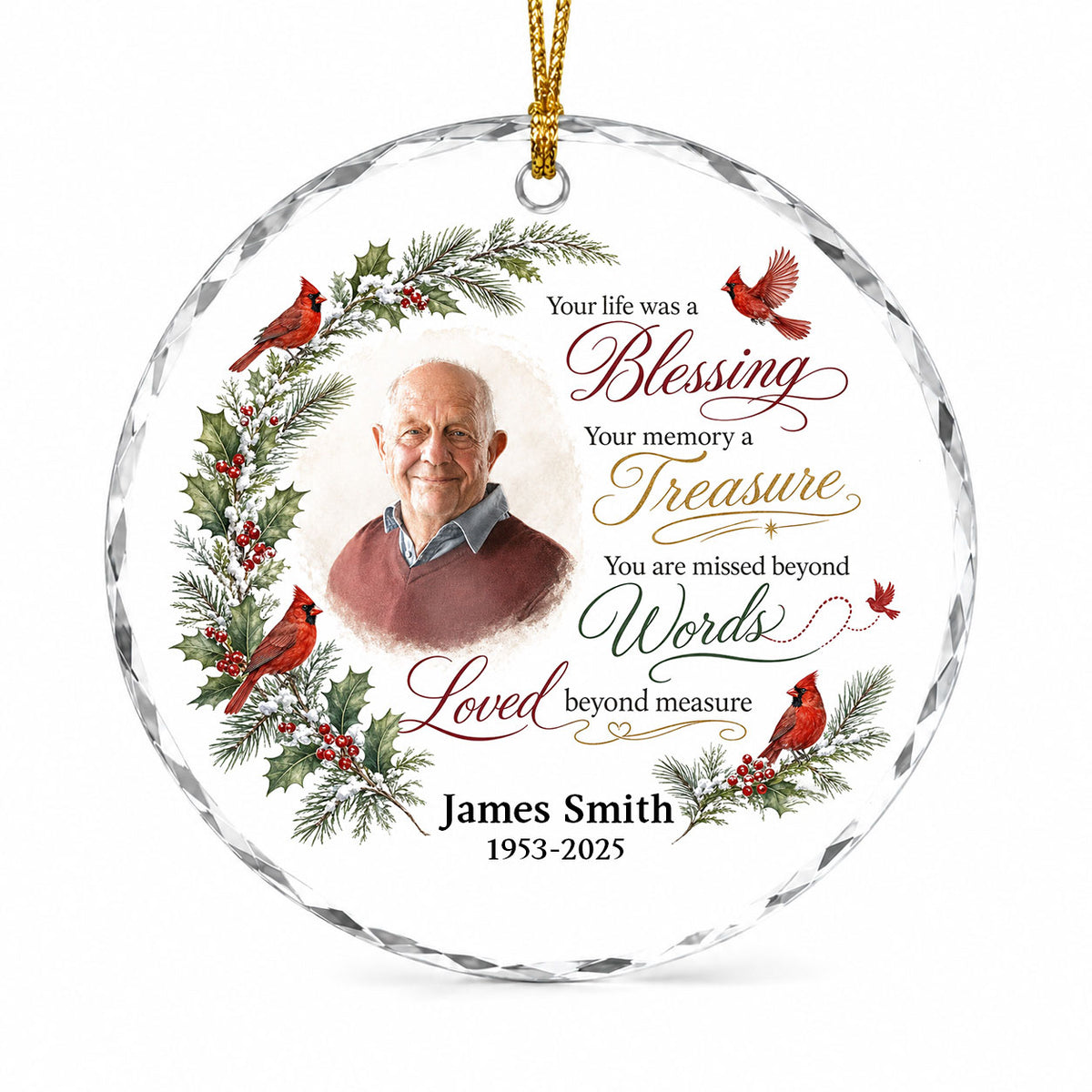 Round glass ornament with memorial quote, four red cardinals, pine and holly greenery, and a center photo portrait.