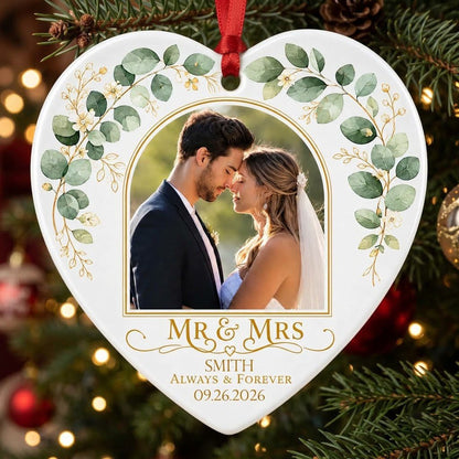 White heart ceramic ornament with wedding photo, eucalyptus leaves, gold accents, and text MR & MRS, ALWAYS & FOREVER.