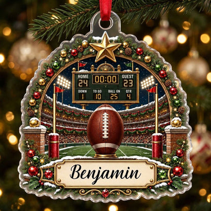 Acrylic ornament with football on a tee, stadium scoreboard, and pine garland border with a name banner.