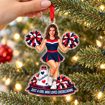 Custom-cut acrylic ornament of a cheerleader in red, navy and white with pom-poms, a megaphone and a name banner.