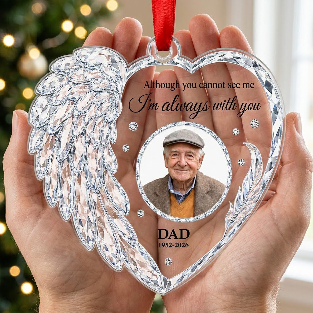 Clear acrylic heart ornament with crystal wing on the left, diamond accents, and a central circular photo frame.