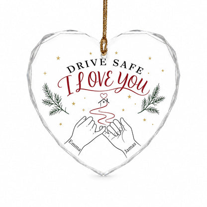 Heart glass ornament with pinky promise hands, red thread to a small house with heart, pine sprigs and gold stars.