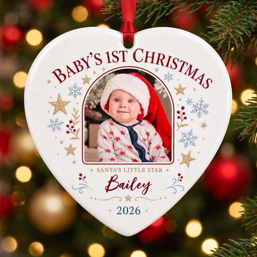 Heart ceramic ornament with arched photo frame, gold stars, blue snowflakes, holly, and 'Baby's 1st Christmas' text.