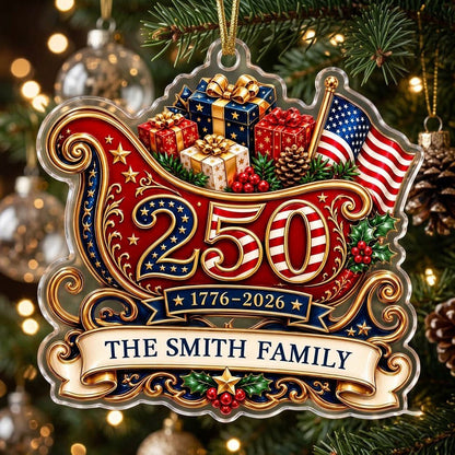 Acrylic ornament shaped like a Santa sleigh with '250', '1776-2026', US flag and a family name banner.