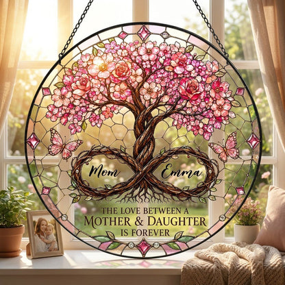 Round suncatcher with tree of life, pink blossoms, and 'THE LOVE BETWEEN A MOTHER & DAUGHTER IS FOREVER'