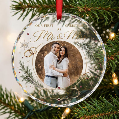 Round glass ornament with couple photo, gold wedding rings, snowflakes and 'OUR FIRST CHRISTMAS AS Mr & Mrs'.