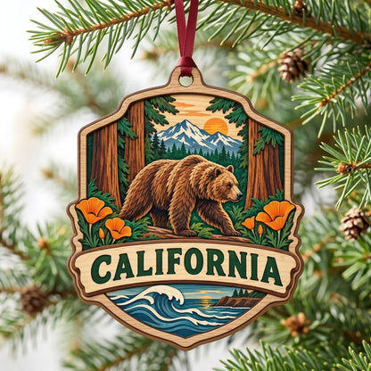 Shield-shaped wood ornament reading CALIFORNIA with bear on log, poppies, redwoods, mountains, and ocean waves.