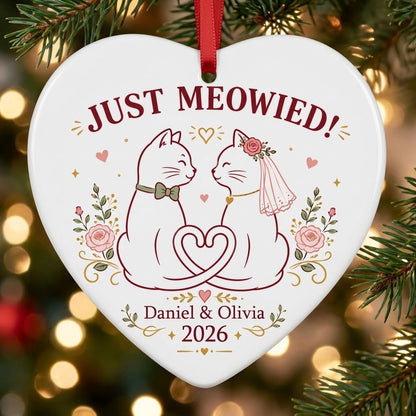 Two white cats with bow tie and bridal veil under JUST MEOWIED with roses and stars on a heart ceramic ornament.