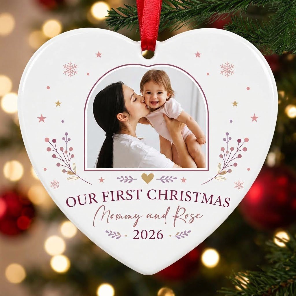 Heart ceramic ornament with “OUR FIRST CHRISTMAS”, arch photo frame, stars, snowflakes, berry sprigs, leafy flourishes, 