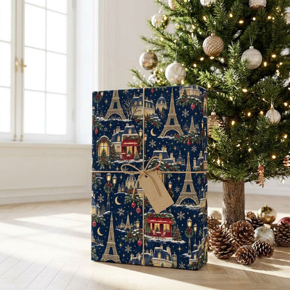 Navy Christmas wrapping paper with golden Eiffel Towers, Parisian buildings, a red cafe, stars, moons and snowflakes.