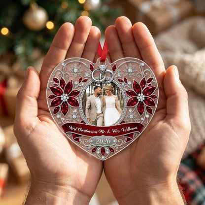 Heart acrylic ornament with couple photo, silver rings, poinsettias, and First Christmas as Mr. & Mrs. 2026.