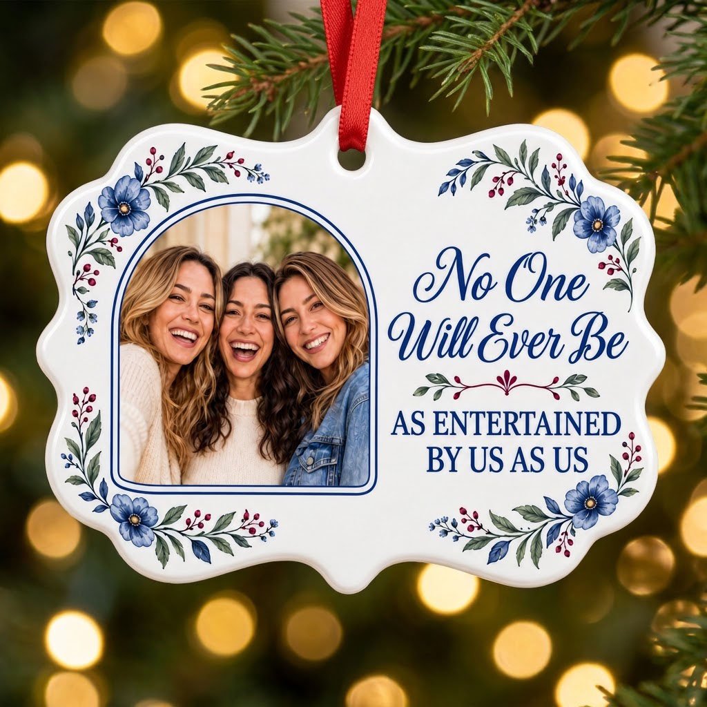 Blue floral ceramic ornament with navy photo frame and the text No One Will Ever Be As Entertained By Us As Us.