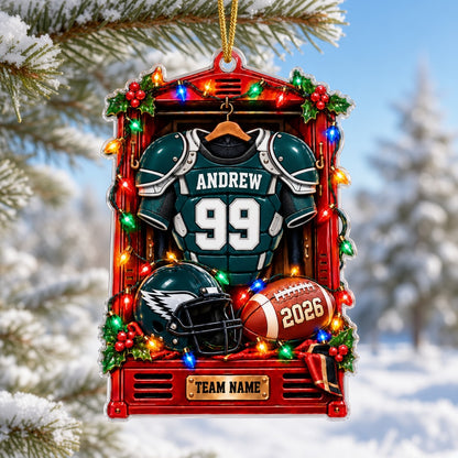 Acrylic ornament of a red football locker with a green jersey, helmet, football, lights and holly for Christmas