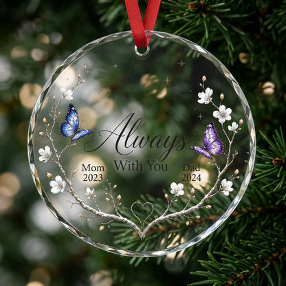 Round glass ornament with branch wreath, white blossoms, blue and purple butterflies, and Always With You text.