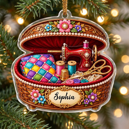 Custom-cut acrylic ornament of a brown sewing basket with a red vintage sewing machine and floral accents