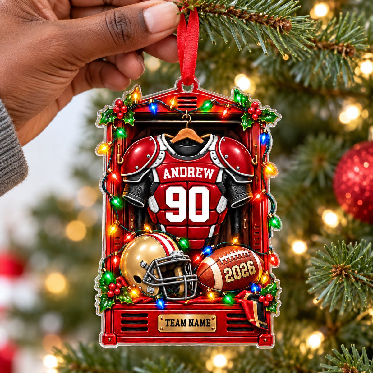 Acrylic ornament with a red football locker, jersey on hanger, gold helmet, brown football and gold plaque