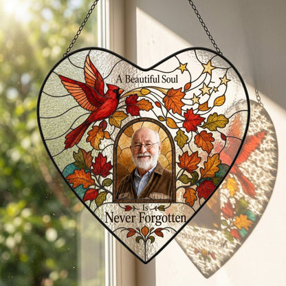 Heart stained glass suncatcher with flying red cardinal, autumn leaves, gold stars, and a central photo frame.
