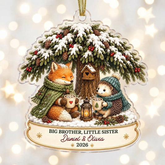 Acrylic ornament with snowy tree, fox and hedgehog holding mugs, banner says BIG BROTHER, LITTLE SISTER.