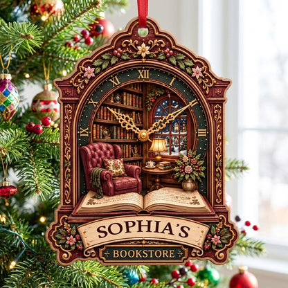 Ornate clock-shaped wood ornament with cozy bookstore scene, red armchair, bookshelves, arched window, and “BOOKSTORE” s